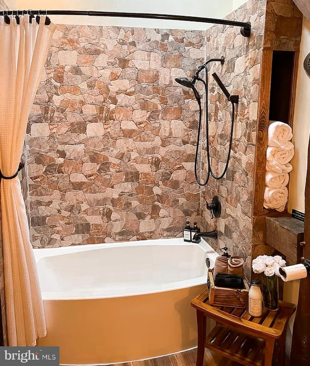 bathroom with shower / bathtub combination with curtain