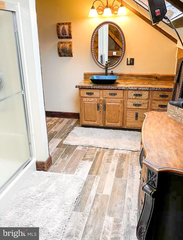 bathroom with vanity and an enclosed shower