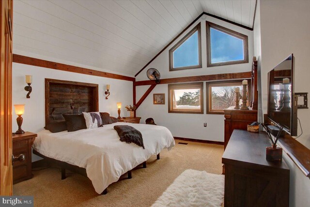 bedroom with light carpet and high vaulted ceiling