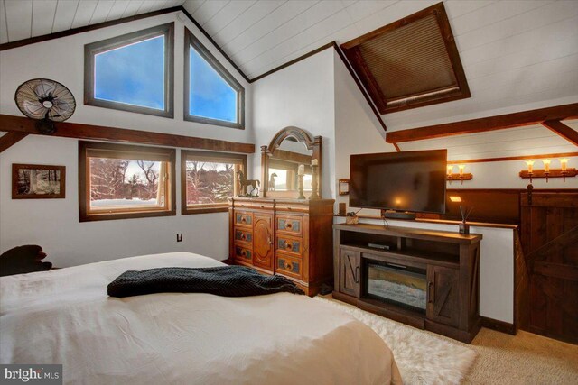 carpeted bedroom with vaulted ceiling