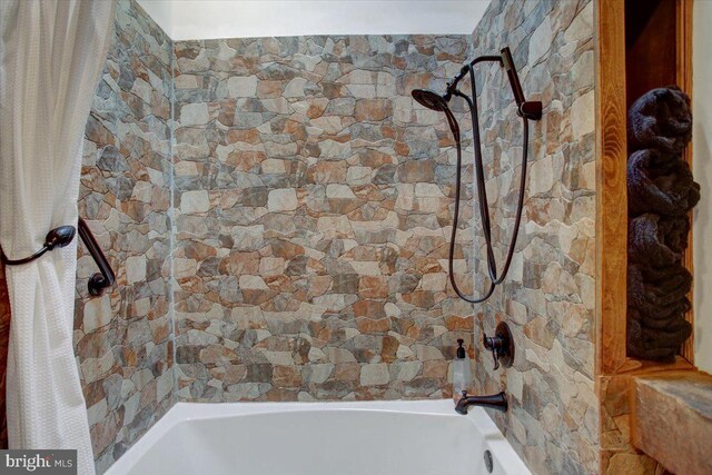 bathroom with shower / bath combination with curtain