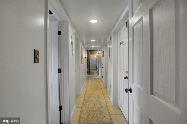 corridor featuring light tile patterned flooring