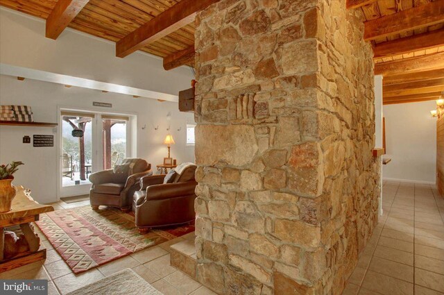 tiled living room featuring beam ceiling and wooden ceiling