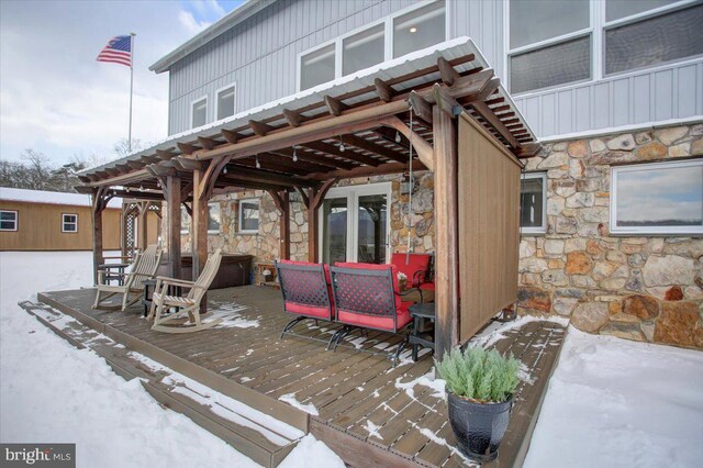 view of snow covered deck