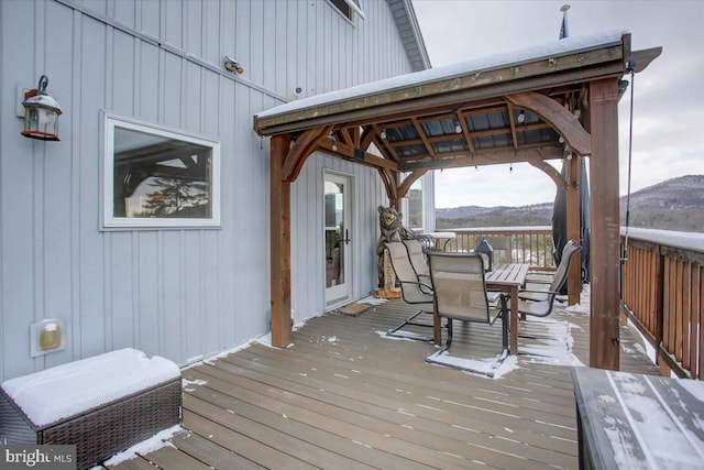 wooden deck featuring a mountain view and a gazebo