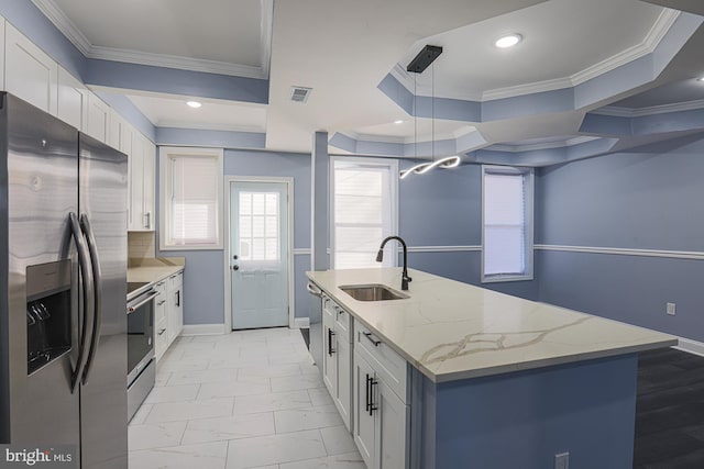 kitchen featuring white cabinetry, sink, hanging light fixtures, an island with sink, and appliances with stainless steel finishes