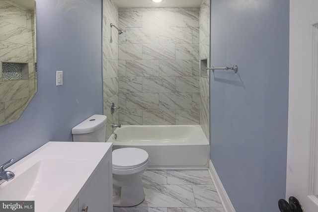 full bathroom with vanity, toilet, and tiled shower / bath