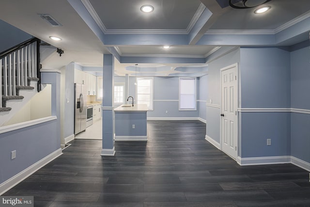 kitchen featuring stainless steel fridge, dark hardwood / wood-style flooring, crown molding, and sink