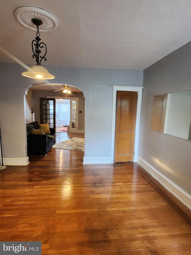 unfurnished room with ceiling fan and hardwood / wood-style floors