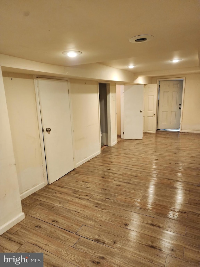 basement featuring hardwood / wood-style flooring