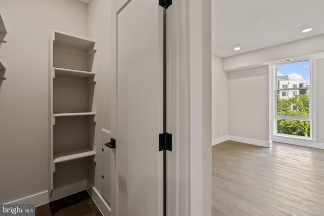 walk in closet featuring light hardwood / wood-style floors