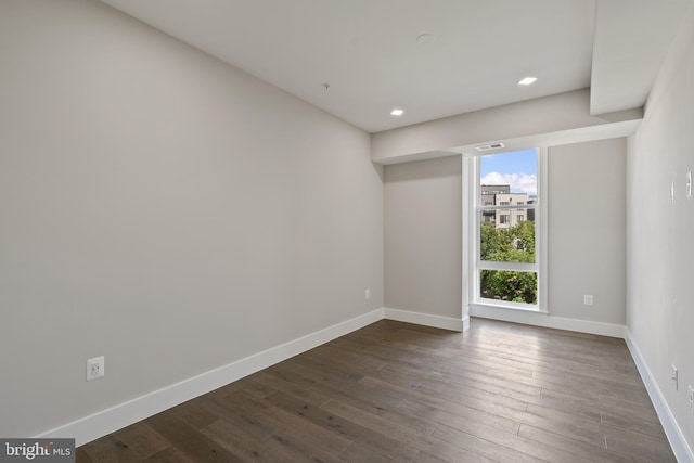 empty room featuring dark hardwood / wood-style floors