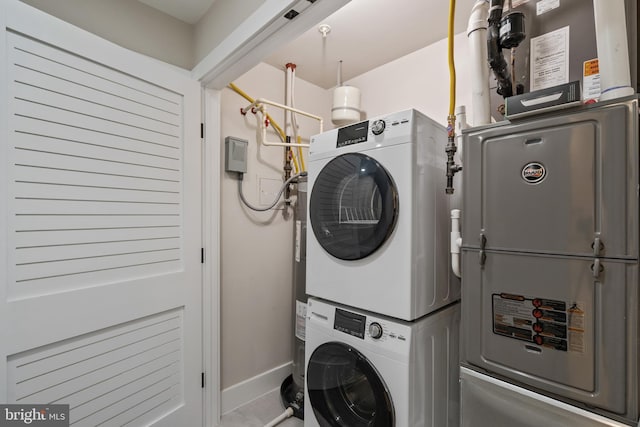 laundry room featuring stacked washer and dryer