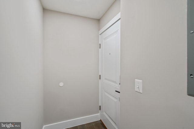 laundry room featuring dark wood-type flooring