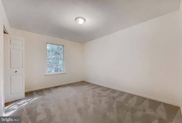 unfurnished room featuring carpet floors