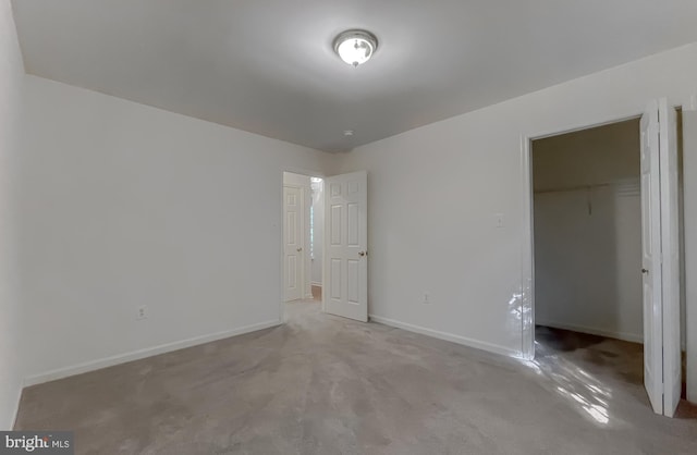 unfurnished bedroom with a closet