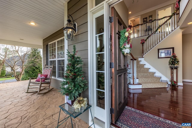 entrance to property featuring covered porch