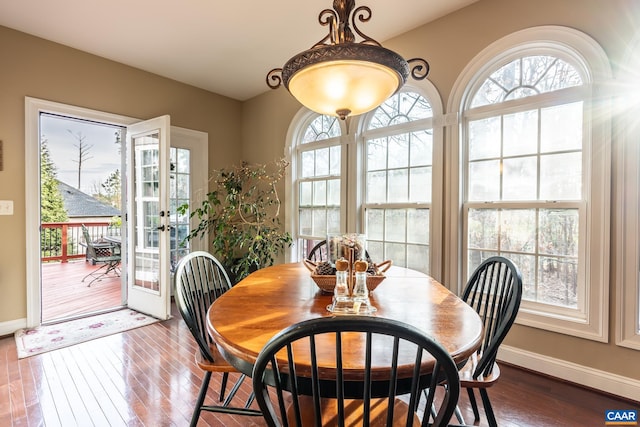 dining area featuring hardwood / wood-style flooring and french doors