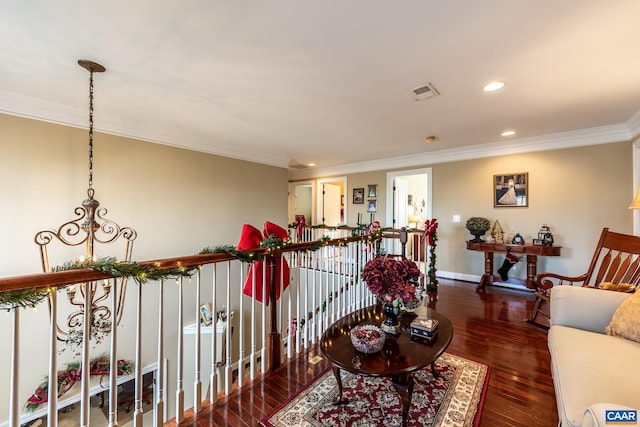 interior space with dark hardwood / wood-style floors and crown molding