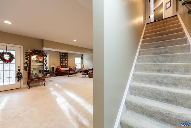 stairs featuring carpet floors