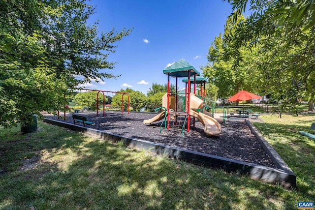 view of playground featuring a lawn