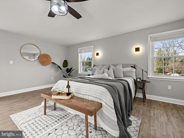 bedroom with ceiling fan and hardwood / wood-style floors