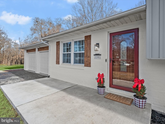 entrance to property featuring a garage