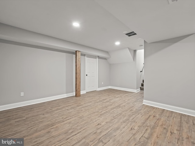 basement featuring light hardwood / wood-style flooring