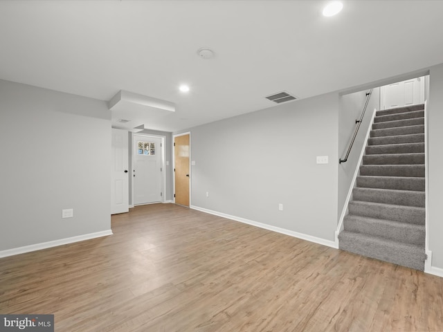 unfurnished living room featuring light hardwood / wood-style flooring