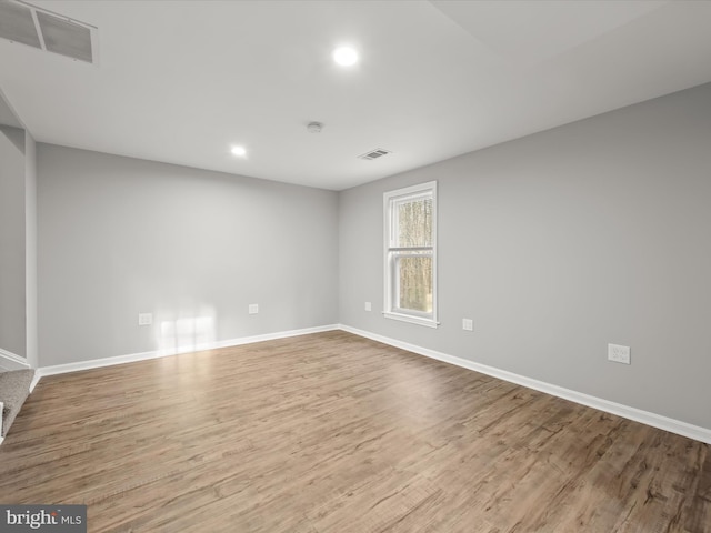 spare room with light wood-type flooring