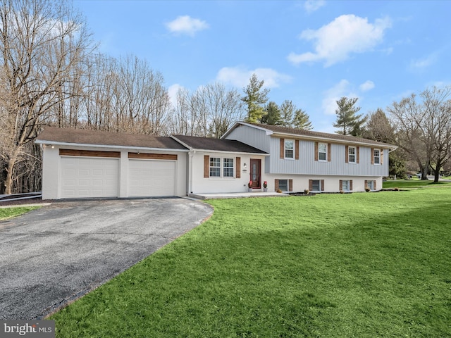 view of front facade with a front yard and a garage