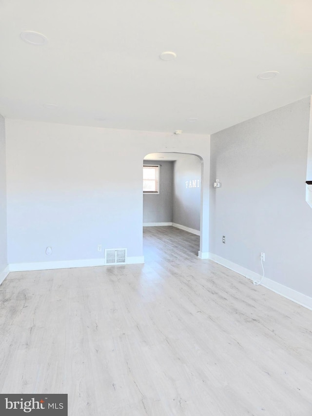 empty room with light wood-type flooring