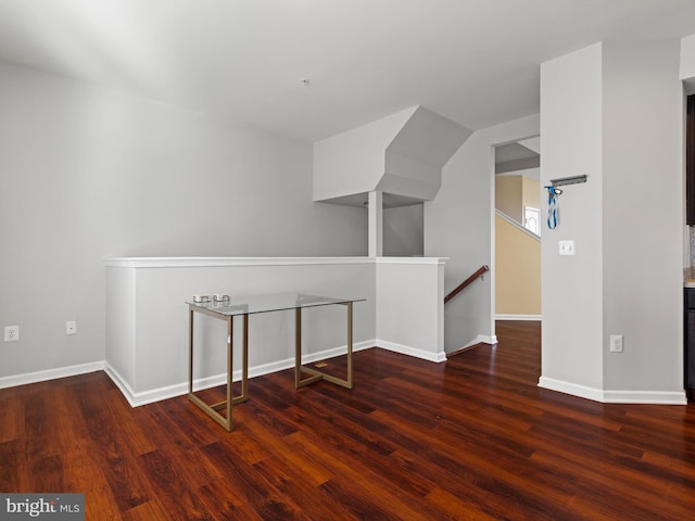 bonus room with dark hardwood / wood-style floors