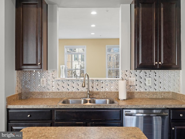 kitchen featuring dishwasher, dark brown cabinets, decorative backsplash, and sink