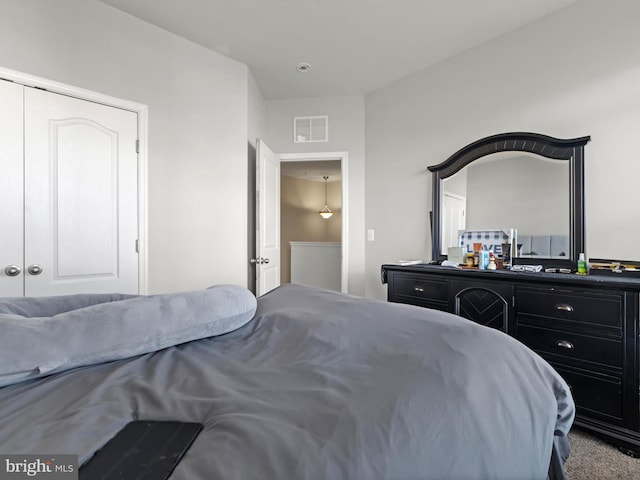 bedroom featuring carpet flooring and a closet