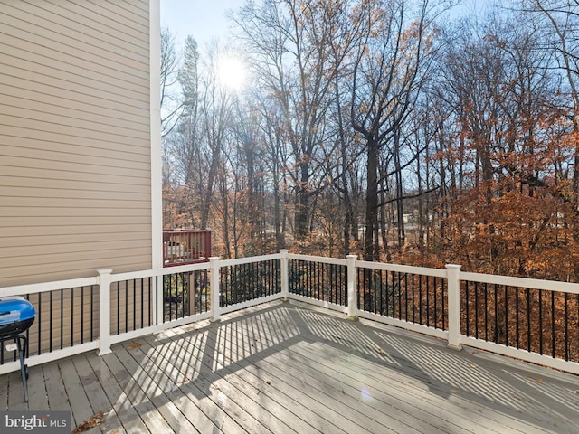 wooden deck featuring area for grilling