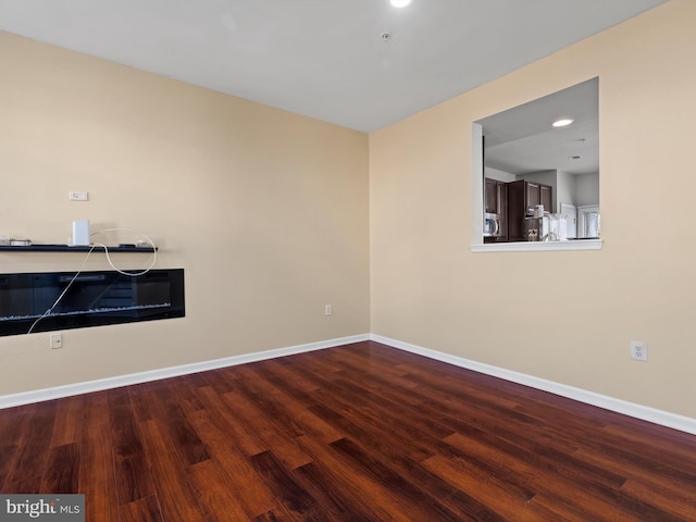 spare room with hardwood / wood-style floors