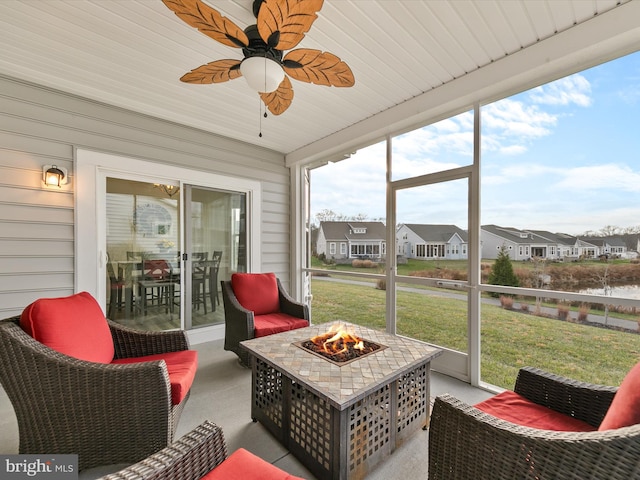 sunroom / solarium with ceiling fan and wood ceiling