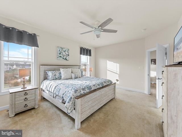 bedroom featuring ceiling fan and light carpet