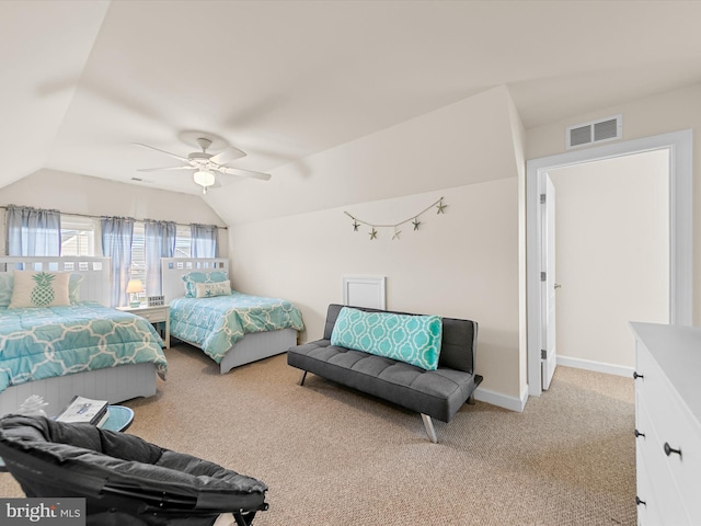 bedroom with ceiling fan, light carpet, and vaulted ceiling