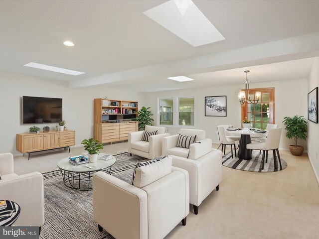 carpeted living room featuring a notable chandelier