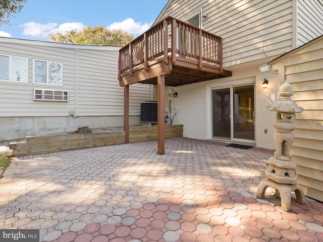 view of patio / terrace featuring central air condition unit and a wooden deck