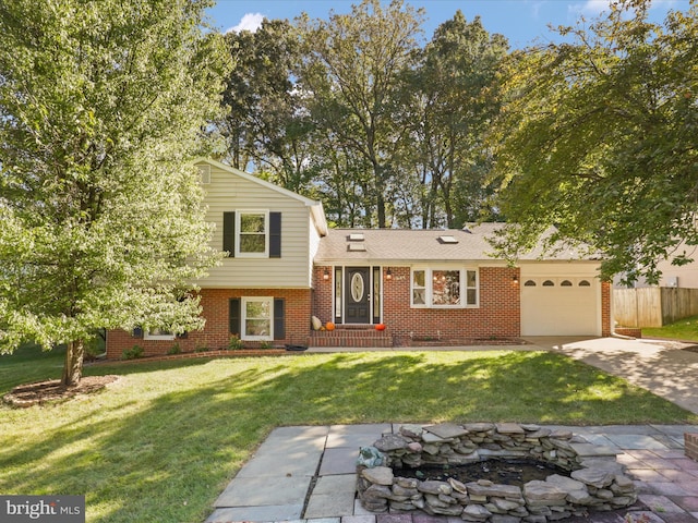 tri-level home with a garage and a front lawn