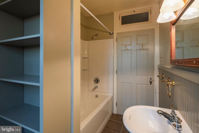 bathroom with tile patterned flooring, sink, and bathing tub / shower combination