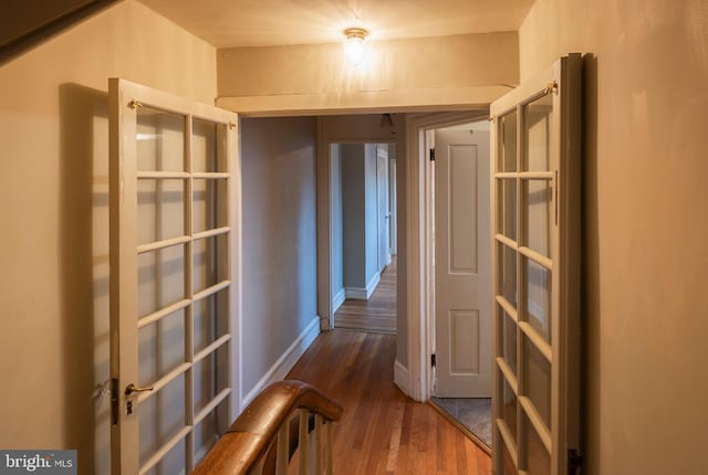 hall with dark hardwood / wood-style floors