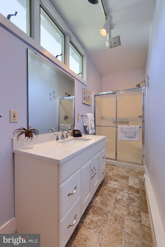 bathroom with vanity and walk in shower