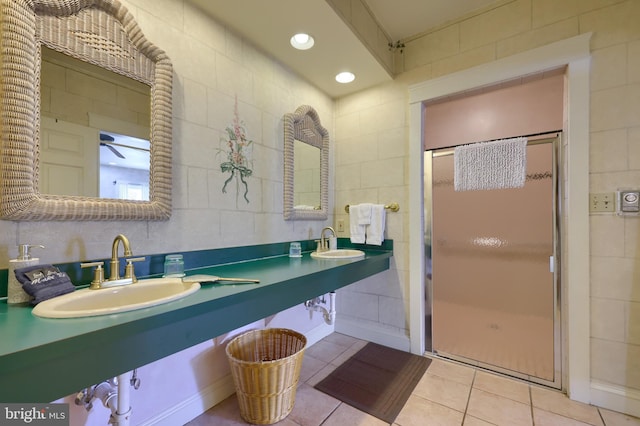 bathroom featuring tile patterned floors, vanity, and tile walls