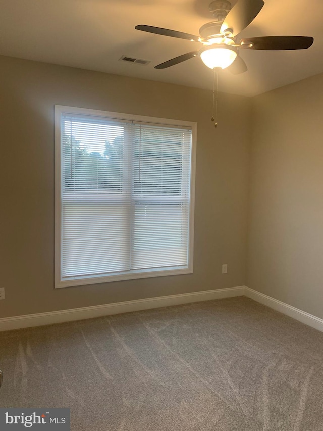 unfurnished room featuring carpet flooring and ceiling fan