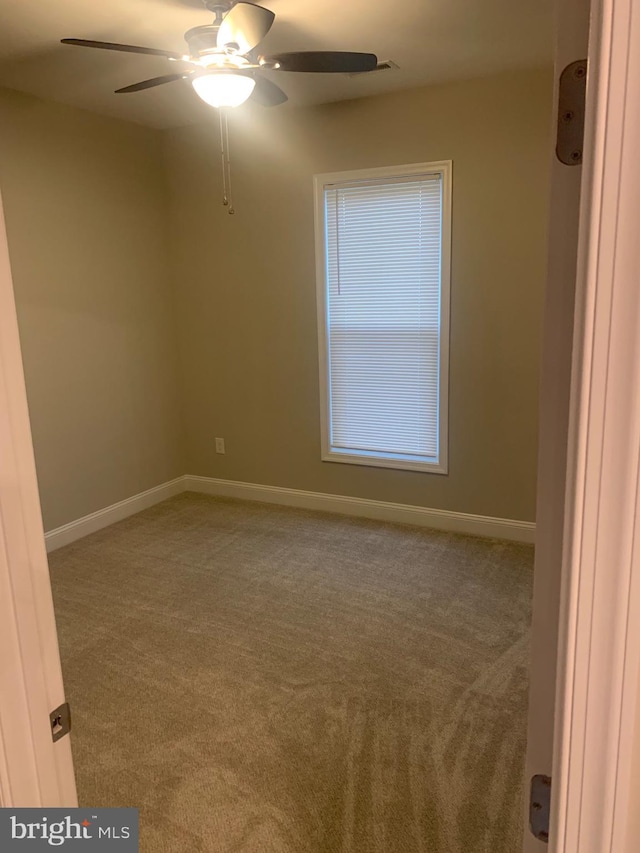 carpeted empty room with ceiling fan