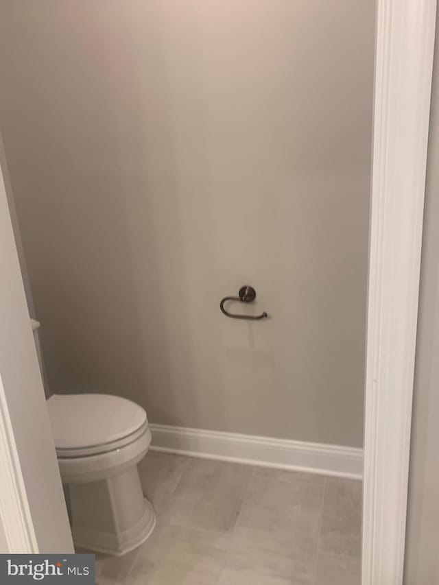 bathroom featuring tile patterned floors and toilet